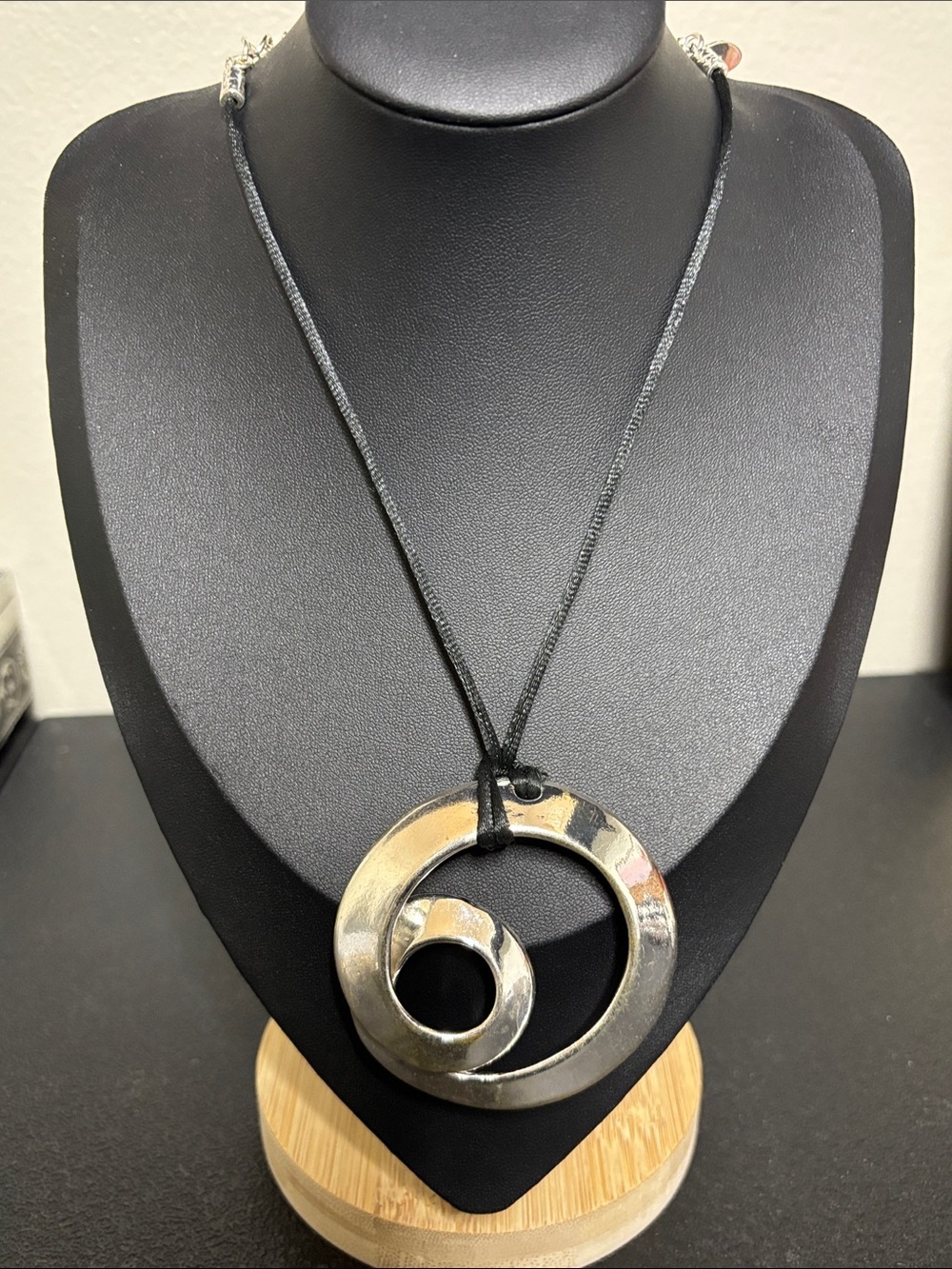 Chico’s Bold Silver Circular Pendant Necklace on Black Cord